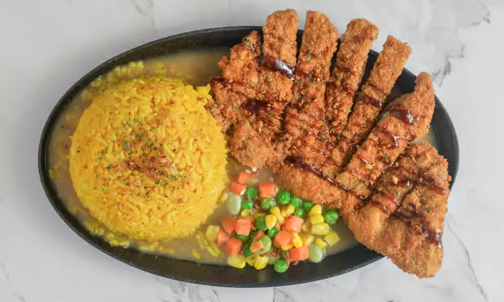 Crispy Pork Belly with java rice - authentic Filipino cuisine at Kalesa Korner in Winnipeg
