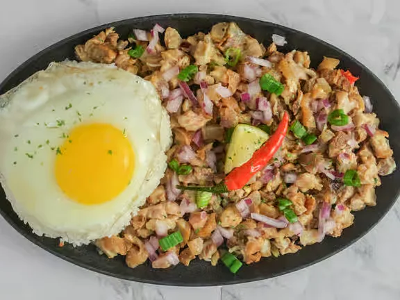 Sisig sizzling plate at Kalesa Korner in Winnipeg, MB