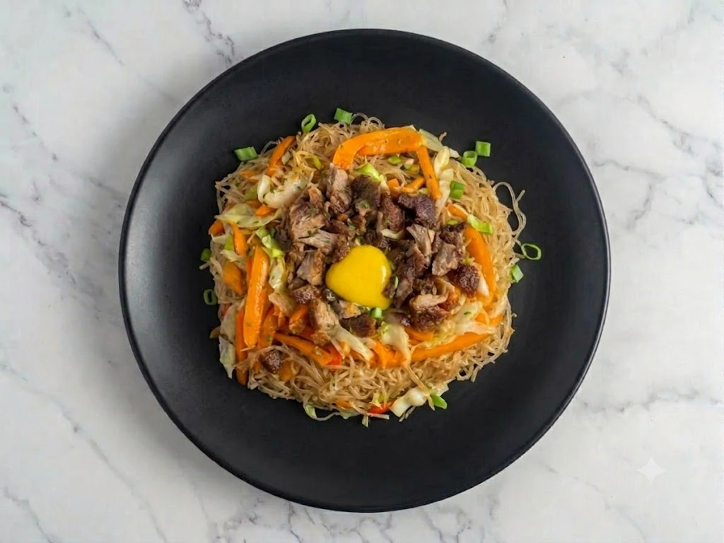 Pancit Bihon with crispy pork at Kalesa Korner in Winnipeg, MB